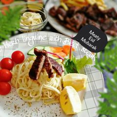 A picture of Garlic Herb linguine with Beef steak.
