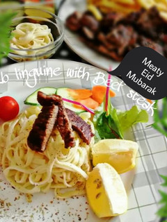 A picture of Garlic Herb linguine with Beef steak.