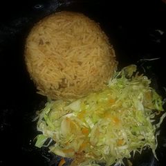 A picture of Pilau served with Veges.