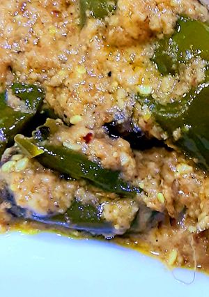 A picture of Green chilli Salan with fried rice.