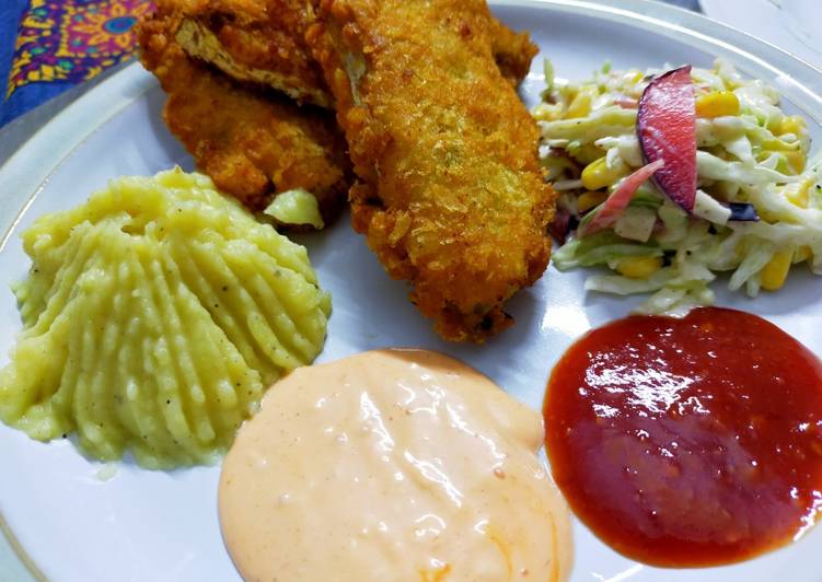Fried fish restaurant style with salad,mash potato and dips