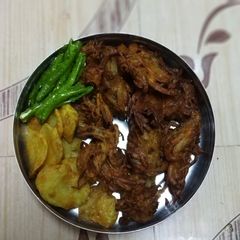 A picture of Kandha and Batata bhaji.