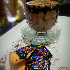 A picture of Mocha coffee with choco cookies.