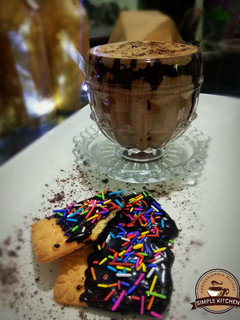 A picture of Mocha coffee with choco cookies.