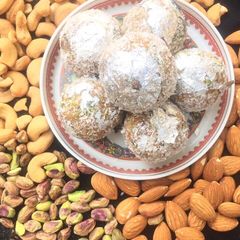 A picture of Channa Daal and Khajoor Halwa and laddoos.