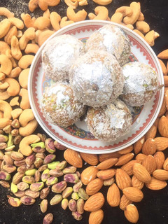 A picture of Channa Daal and Khajoor Halwa and laddoos.