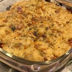 A picture of Baked potato and chkn with bechamel sauce.