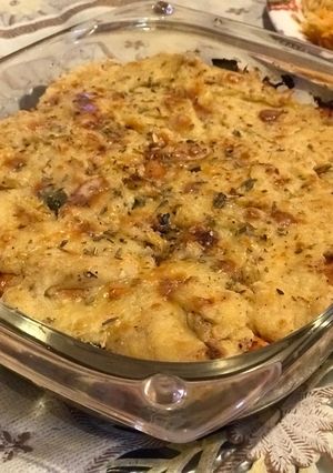 A picture of Baked potato and chkn with bechamel sauce.