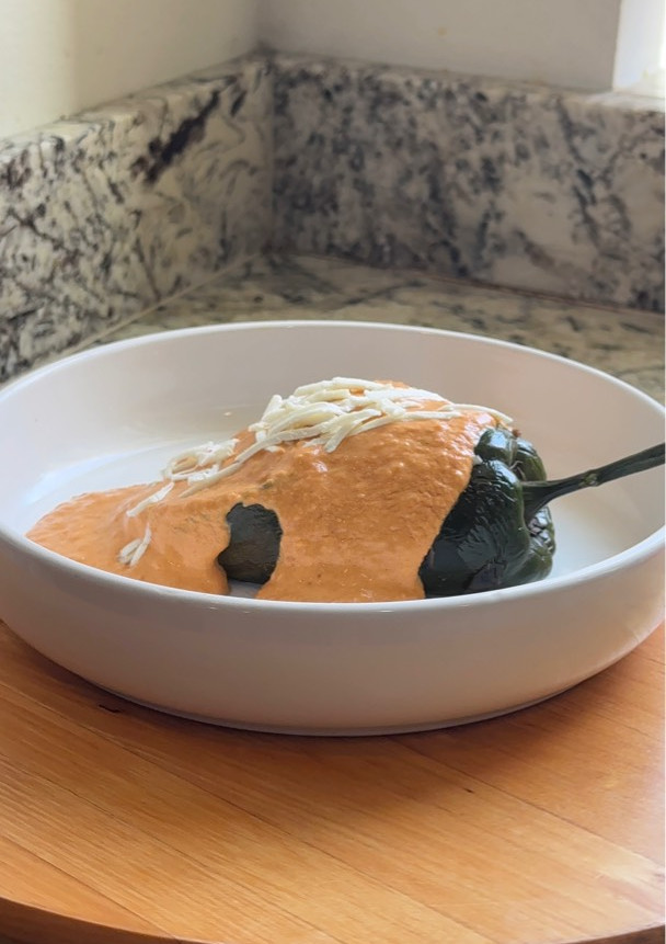A picture of Chile Relleno with Picadillo and Chipotle Sauce.
