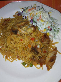 A picture of Spaghetti and shredded chicken.