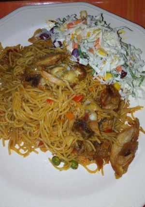 A picture of Spaghetti and shredded chicken.