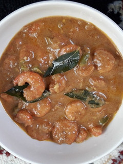 A picture of Prawns in coconut curry.
