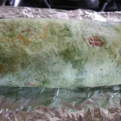 A picture of Spinach wrap Bacon and Egg Breakfast Burrito.