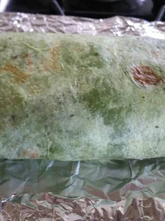 A picture of Spinach wrap Bacon and Egg Breakfast Burrito.