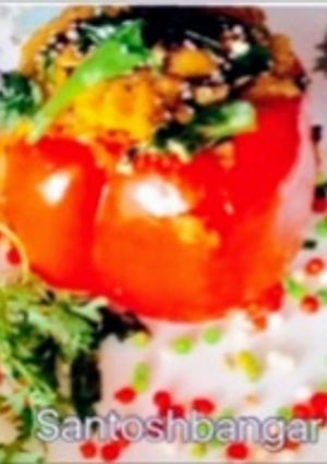 A picture of Dhokla stuffed Red Capsicum.