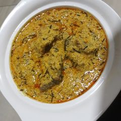 A picture of Egusi soup with ukazi.