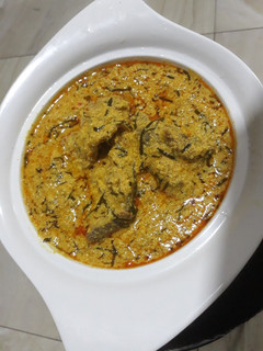 A picture of Egusi soup with ukazi.