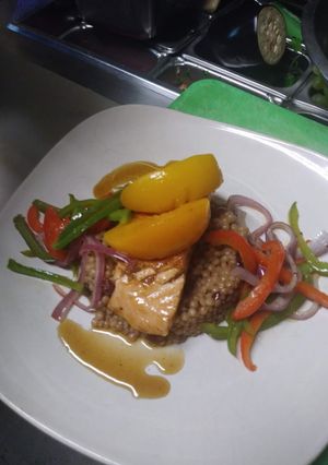 A picture of Peach Bourbon Salmon w/ Cranberry Cous cous and Vegetable Medley.