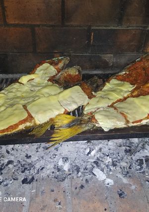 Una foto de Dorado a la pizza