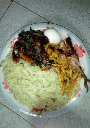 A picture of Curry Rice with sauce.