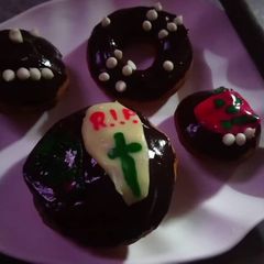 A picture of Spooky halloween (chocolate) doughnuts.