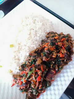 A picture of White Rice and beef vegetable sauce.