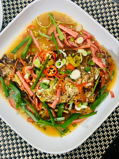 A picture of Crispy fried Red Snapper fish in Thai style tamarind sauce.