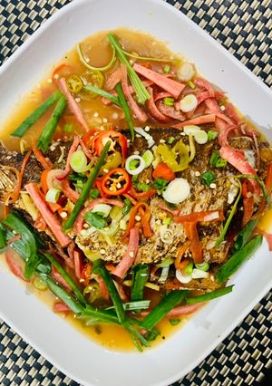 A picture of Crispy fried Red Snapper fish in Thai style tamarind sauce.