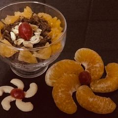 A picture of Chocolate rice and orange pudding.