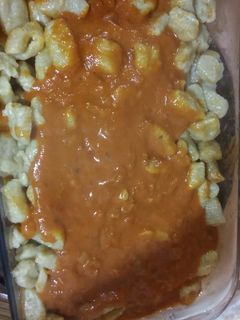 Una foto de Ñoquis de calabaza con salsa rosa