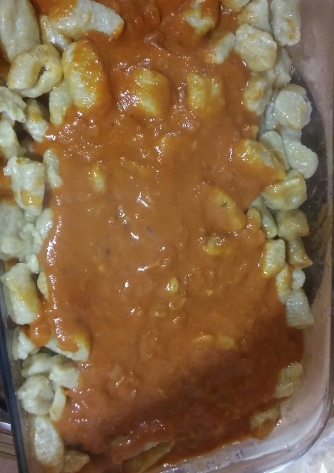 Una foto de Ñoquis de calabaza con salsa rosa