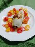 Eggplant-Stuffed Calamari on a Bed of Cherry Tomatoes