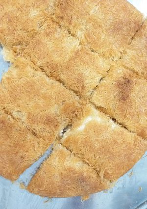 A picture of Knafeh with Cream.