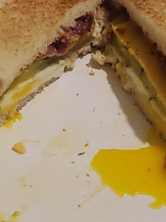 A picture of Bacon and egg sandwich.
