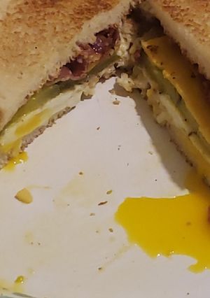 A picture of Bacon and egg sandwich.