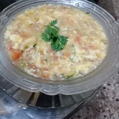 A picture of Tomato_mushroom egg drop soup.