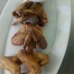 A picture of Chicken wings and kachumbari.