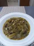 Cardo en salsa con jamón y pasas