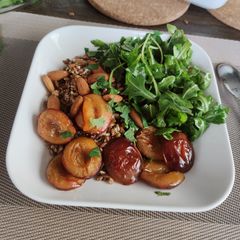 A picture of Rye bowl with plum and arugula.