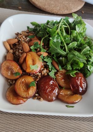 A picture of Rye bowl with plum and arugula.