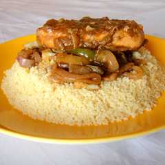 A picture of Chicken Steak and Cous Cous.