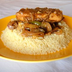 A picture of Chicken Steak and Cous Cous.