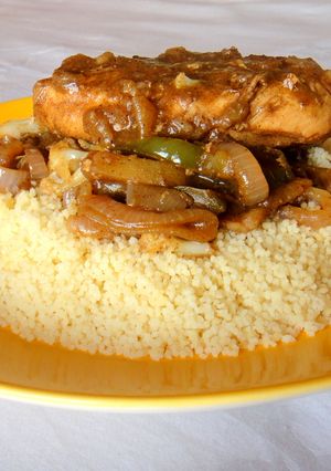 A picture of Chicken Steak and Cous Cous.