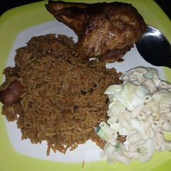 A picture of Brown rice with grilled chicken served with macaroni & potatoes.