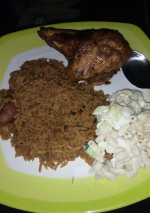 A picture of Brown rice with grilled chicken served with macaroni & potatoes.