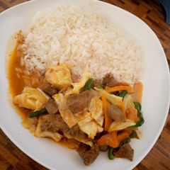 A picture of White rice paired with beef shredded pepperoni veggies.