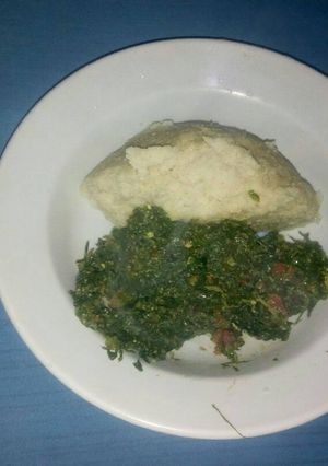 A picture of Ugali,kales and eggs.