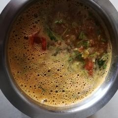 A picture of South Indian tomato rasam.