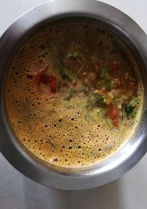 A picture of South Indian tomato rasam.