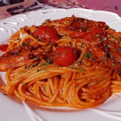 A picture of Cherry tomato and shrimp pasta.